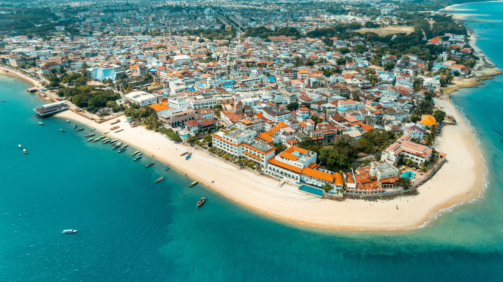 Aerial view of Stone Town, Zanzibar, its beach and turquoise sea